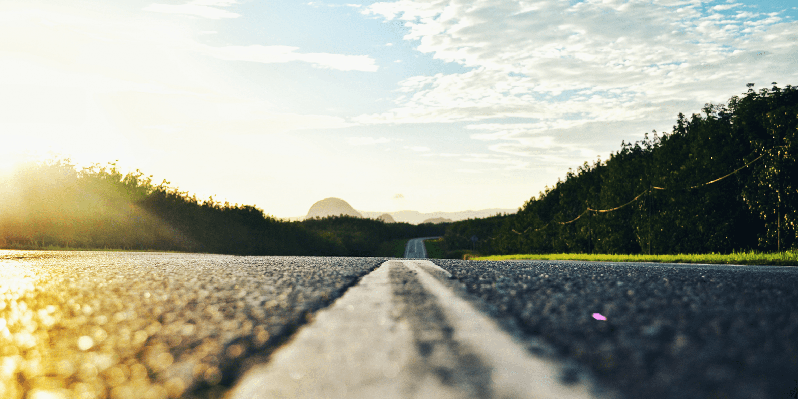 on-the-road-closeup-of-pavement-under-blue-sky