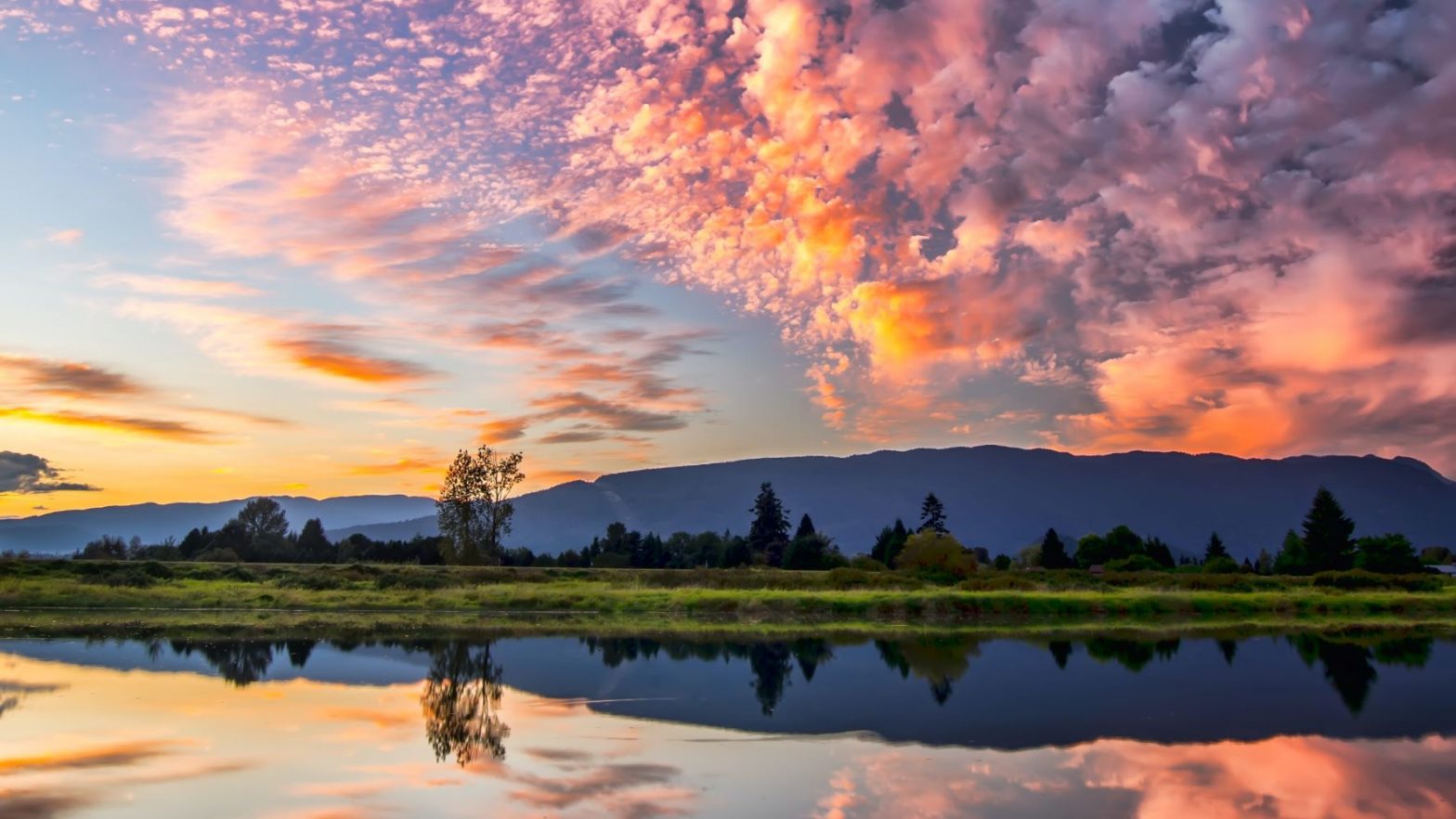 pink-clouds-over-mountain-reflected-in-burlington-lake